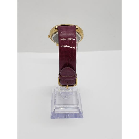 Women\'s dress watch. Large purple face with gold accents. main image 8